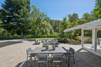 03 - 3435 Black Hawk Road - Backyard patio with outdoor dining area and seating area