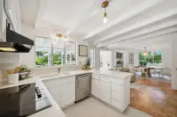 12 - 3435 Black Hawk Road - Kitchen with peninsula and view of dining room