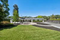 16 - 3435 Black Hawk Road - Rear exterior of the property with backyard, patio, and tennis court