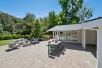 17 - 3435 Black Hawk Road - Backyard patio with outdoor dining area and seating area near sunroom