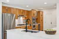 13 - 574 Monarch Ridge Drive - Kitchen with quartz countertops and stainless steel appliances