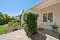 3 _ side-patio-entrance-brick-walkway-ivy-door