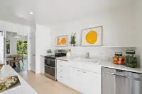 12 _ kitchen-galley-view-citrus-artwork-wood-floor