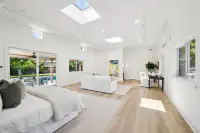 25 _ primary-suite-sofa-abstract-artwork-sliding-door