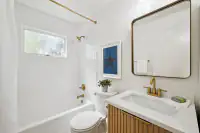 28 _ bathroom-tub-shower-combo-gold-fixtures-star-art