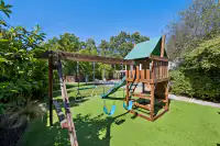 33 _ backyard-playset-swings-pool-in-background