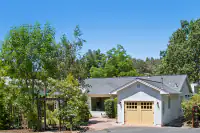 34 _ front-exterior-garage-yellow-doors-rose-arbor