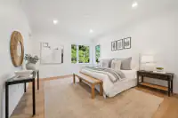 14 _ bedroom-neutral-bedding-round-mirror-botanical-art