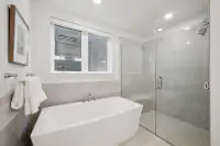 17 _ bathroom-soaking-tub-glass-shower-gray-tile