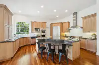 5 _ 2 Reliez Manor Court - Kitchen with large island, wood cabinetry, and stainless steel appliances