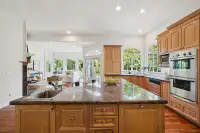 9 _ 2 Reliez Manor Court - Kitchen with large island, wood cabinetry, and stainless steel appliances