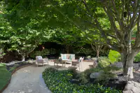 12 _ 2 Reliez Manor Court - Backyard seating area with landscaped garden and mature trees