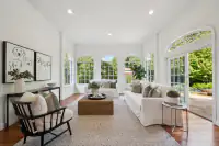 13 _ 2 Reliez Manor Court - Living room with seating area, arched windows, and French doors to the patio