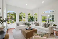 14 _ 2 Reliez Manor Court - Living room with seating area, arched windows, and French doors to the patio