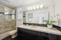 22 _ 2 Reliez Manor Court - Secondary bathroom with tub/shower combination, vanity, toilet, and mirrored wall cabinet