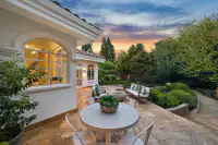 29 _ 2 Reliez Manor Court - Backyard patio with outdoor dining area, seating, landscaped garden, and pathways