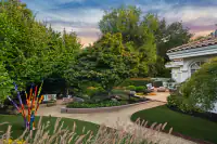 30 _ 2 Reliez Manor Court - Backyard with landscaped garden, outdoor seating, pathways, and lawn