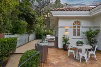 31 _ 2 Reliez Manor Court - Backyard patio with outdoor dining area, built-in grill, and garden pathway