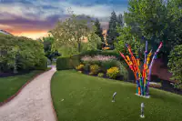 33 _ 2 Reliez Manor Court - Backyard putting green with landscaping, pathways, and mature trees