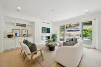 14 _ 31 Sandy Court _ Family room with fireplace and sliding doors to the outdoor area