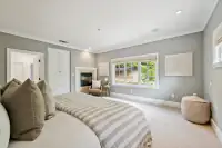 29 _ 31 Sandy Court _ Primary bedroom with fireplace and ensuite access