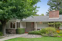 2 _ 808 Rosedale - Front exterior with covered entry, landscaped garden beds, mature tree, and brick chimney