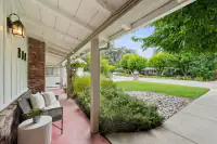 4 _ 808 Rosedale - Covered front porch with seating, landscaped yard, and walkway to the street