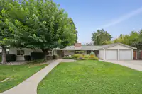 1 _ 808 Rosedale - Front exterior with landscaped lawn, walkway, mature trees, covered entry, and attached two-car garage