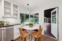 10 _ 808 Rosedale - Kitchen breakfast nook with built-in seating, glass-front cabinets, and access to the covered patio
