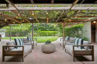 11 _ 808 Rosedale - Covered patio with pergola, string lights, lounge seating, and views of the backyard