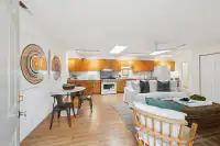 26 _ 808 Rosedale - Guest house interior with open living, dining, and kitchen areas