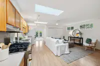 28 _ 808 Rosedale - Guest house interior with open kitchen and living area