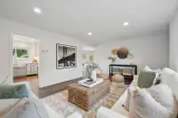 4 _ 866 Wilmore Ave _ Living room with sofas, wicker coffee table, and area rug