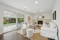 9 _ 866 Wilmore Ave _ Family room with a fireplace, seating area, and sliding glass door to the backyard