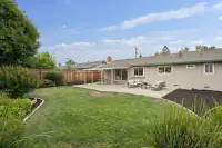 20 _ 866 Wilmore Ave _ Backyard with lawn, concrete patio, outdoor seating, and fenced perimeter
