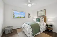 18 _ 866 Wilmore Ave _ Bedroom with a bed, nightstand, ceiling fan, and window