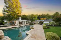 4 _ 3724 Happy Valley Road _ Pool with paved patio, landscaping, and seating area