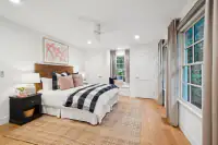 37 _ 3724 Happy Valley Road _ Bedroom with windows and ceiling fan