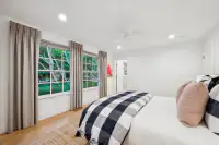 38 _ 3724 Happy Valley Road _ Bedroom with windows and ceiling fan