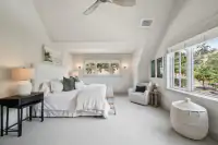 26 _ 1751 Reliez Valley Road _ Bed with upholstered headboard, sitting area, and large windows