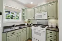 41 _ 1751 Reliez Valley Road _ Kitchen with green cabinetry, gas range, microwave, and corner sink