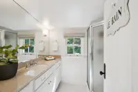 42 _ 1751 Reliez Valley Road _ Long vanity with mirrored wall, window, and glass-enclosed shower