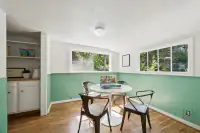 48 _ 1751 Reliez Valley Road _ Dining area with round table, four chairs, built-in shelving, and surrounding windows