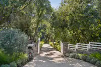54 _ 1751 Reliez Valley Road _ Driveway entrance with stone pillars and white fencing