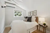 37 _ 1751 Reliez Valley Road _ Bedroom with wood headboard, window, wall sconces, and mini-split