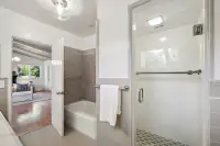 20 _ 3336 Las Huertas _ Primary Bath with tub and glass-enclosed shower