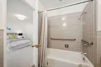 27 _ 3336 Las Huertas _ Bath with tiled shower and grab bars