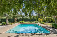 37 _ 3336 Las Huertas _ Backyard Pool with surrounding landscaping