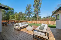 13 _ 3208 Camino Colorados - Backyard deck with outdoor seating and lawn area