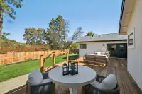 16 _ 3208 Camino Colorados _ Backyard deck with outdoor seating and a round table